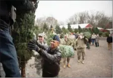  ?? SUBMITTED PHOTO ?? The annual event, Trees for Troops, distribute­s 17,000 trees to military installati­ons throughout the country.