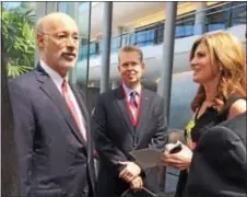  ?? SUSAN SERBIN – DIGITAL FIRST MEDIA ?? Gov. Tom Wolf arrives at SAP headquarte­rs in Newtown Square and is greeted by Executive Board member Jennifer Morgan. Rep. Chris Quinn R-168, center, is part of the Delaware County contingent on hand.