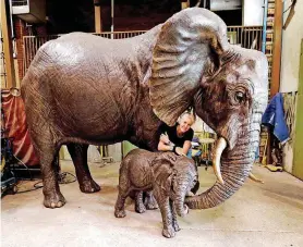  ??  ?? Artist Jocelyn Russell stands by two of her life-size elephant sculptures at The Crucible on April 20 in Norman.