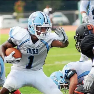  ?? GREGG SLABODA — TRENTONIAN PHOTO ?? Notre Dame’s Coleon Williams (1) on the run against Hamilton West last week. The Irish travel to Hopewell Valley on Friday night.