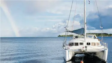  ??  ?? This private catamaran drops anchor nightly in one of French Polynesia’s tranquil lagoons.