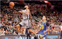  ?? Reuters ?? Spurs’ Patty Mills (8) shoots the ball past Warriors’ Matt. —