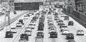  ?? Frederic J. Brown / AFP/Getty Images ?? Traffic flows in Los Angeles. Air-quality advocates are appalled by the Trump administra­tion’s rollback of the state’s authority to set fuel standards.