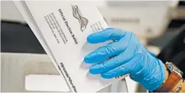  ?? MATT SLOCUM/AP ?? In presidenti­al elections, thousands of mail-in ballots are rejected. They may have arrived late or were missing a signature.
