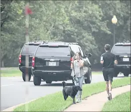  ?? J. SCOTT APPLEWHITE — THE ASSOCIATED PRESS ?? President Donald Trump’s motorcade on its way to his golf course in Sterling, Va.