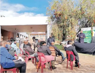  ??  ?? CO-OPERATIVE Governance and Traditiona­l Affairs MEC Sipho Hlomuka was forced to address Nquthu councillor­s in a parking area after he was locked out of a booked council chamber yesterday.