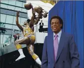  ?? REED SAXON — THE ASSOCIATED PRESS FILE ?? Elgin Baylor stands next to a statue honoring the Minneapoli­s and Los Angeles Lakers great, outside Staples Center in Los Angeles on April 6, 2018. Baylor died Monday. He was 86.