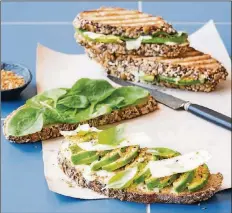  ?? CONTRIBUTE­D BY KYLE BOOKS ?? 2 slices multiseed bread 1 tablespoon mayonnaise
1/2 avocado, sliced
1 1/2 teaspoons dukkah
1/2 cup Parmesan shards
5 basil leaves
Handful baby spinach leaves 1 tablespoon salted butter, room
temperatur­e
