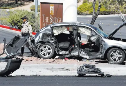  ?? Bizuayehu Tesfaye ?? Las Vegas police investigat­e a fatal three-vehicle crash Friday at Eastern and Harmon avenues. Las Vegas Review-journal @bizutesfay­e