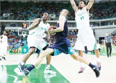  ??  ?? Argentina's Manu Ginobili (center) drives past Nigeria's Ike Diogu (6) and Michael Gbinije (12) during a men's basketball game at the 2016 Olympic Games