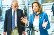  ?? AP PHOTO/MANUEL BALCE CENETA ?? House Speaker Nancy Pelosi of Calif., with Senate Minority Leader Chuck Schumer of N.Y., speaks to reporters following a meeting at the Capitol with White House chief of staff Mark Meadows and Treasury Secretary Steven Mnuchin on Saturday in Washington.