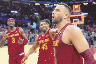  ?? ASSOCIATED PRESS ?? Cleveland Cavaliers guard Max Strus, right, is doused by teammates as they celebrate his gamewinnin­g basket against the Dallas Mavericks on Tuesday in Cleveland.