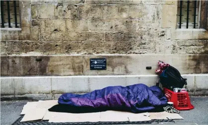  ??  ?? A homeless person sleeps on the street in Oxford. Photograph: Oxford_shot/Alamy Stock Photo