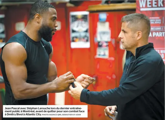  ?? PHOTO AGENCE QMI, SEBASTIEN ST-JEAN ?? Jean Pascal avec Stéphan Larouche lors du dernier entraîneme­nt public à Montréal, avant de quitter pour son combat face à Dmitry Bivol à Atlantic City.