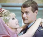  ?? SONY PICTURES HOME ENTERTAINM­ENT ?? Eden’s Jeannie wraps her hands around Larry Hagman’s Major Anthony Nelson.