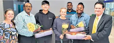  ?? ?? City of uMhlathuze Deputy Mayor Christo Botha (far right) welcomes the Logos Hope line-up team with the local Ports Committee (back) Pastor Shalin Govinden, Marelize Berning, Pastor Timothy Harry, and line-up team Eiki Endo, Sarah Müller and Cecilia Tyamzashe