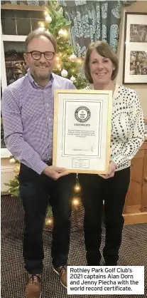  ?? ?? Rothley Park Golf Club’s 2021 captains Alan Dorn and Jenny Piecha with the world record certificat­e.