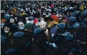  ?? DMITRI LOVETSKY — THE ASSOCIATED PRESS FILE ?? People clash with police during a protest against the jailing of Russian opposition leader Alexei Navalny in St. Petersburg, Russia.