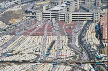  ?? AP/SAUDI PRESS AGENCY ?? Thousands of Muslim pilgrims make their way to cast stones at a pillar symbolizin­g the stoning of Satan in a ritual called Jamarat, the last rite of the annual hajj, on the first day of Eid al-Adha, on Thursday in Mina, Saudi Arabia.