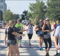  ?? TIM PHILLIS — FOR THE NEWS-HERALD ?? Runners cross the finish line at the Captains Grand Slam 5K on July 4 in Eastlake.
Race directors are excited for the Johnnycake Jog July 12 after the success of the Captains 5K on July 4 in Eastlake.