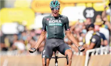  ?? Reuters ?? ↑
Nils Politt celebrates as he crosses the finish line to win the twelfth stage of the Tour de France in Nimes on Thursday.