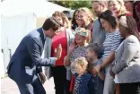  ?? — AFP ?? Liberal Party leader and Canada’s Prime Minister Justin Trudeau gives a high five to a young supporter after a news conference at Rideau Hall in Ottawa on Wednesday.