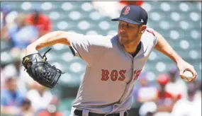  ?? Ron Jenkins / Getty Images ?? Chris Sale throws against the Rangers during the first inning at Globe Life Park on Sunday in Arlington, Texas.