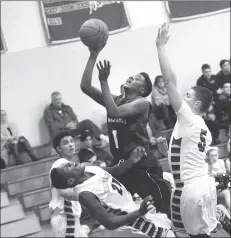  ?? Photo by Ernest A. Brown ?? The Woonsocket boys basketball team likely needs to win three of its last four games to reach the Division I playoffs. The Villa Novans were beaten by Bishop Hendricken Wednesday night.