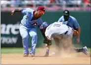  ?? RICH SCHULTZ — THE ASSOCIATED PRESS ?? The Los Angeles Dodgers’ AJ Pollock (11) steals second base before the tag by Philadelph­ia Phillies second baseman Jean Segura (2) Thursday in Philadelph­ia.