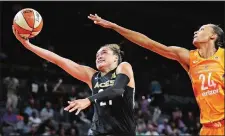  ?? JOHN LOCHER/AP FILE PHOTO ?? In this Aug. 1, 2018 file photo, Las Vegas Aces guard Kayla McBride, left, shoots around Phoenix Mercury forward DeWanna Bonner during the second half of a WNBA basketball game in Las Vegas. McBride’s eyes light up when talking about the Las Vegas offense.