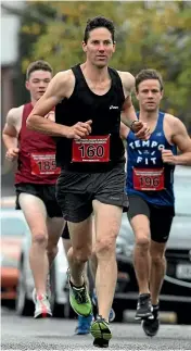  ??  ?? Kyle Bridgeman from New Plymouth led the pack from the start to win the half marathon.