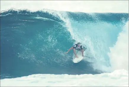  ?? PICTURE: WSL/HEFF ?? BEATING THE CURL: Benji Brand squeezes out of a tube on his way to another heat victory in the Volcom Pipe Pro in Hawaii.