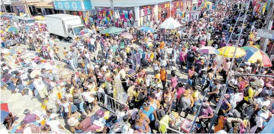  ?? FILE ?? This file photo shows people shopping in downtown Kingston. Peter Espeut writes: As we rigorously pursue policies to become the darlings of the IMF, World Bank, the IDB, Moodies, Fitch, and Standard & Poor’s, what about the ratings of the Jamaican people?