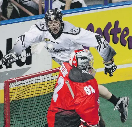  ?? EDMONTON JOURNAL/ FILES ?? Edmonton Rush’s Mark Matthews, shown trying to flip the ball over the net and past goaltender Frankie Scigliano of the Calgary Roughnecks last season, is a big, talented body the Roughnecks must contend with in Game 2 of the NLL West Division final.