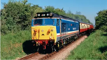  ??  ?? BELOW: 50027 Lion, has retained revised Network Southeast livery throughout it 29 years in preservati­on. Looking magnificen­t on its first day in service after entering preservati­on, 50027 works from Alton to Alresford on May 17, 1992. Martin Loader