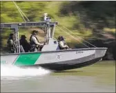  ??  ?? A CUSTOMS and Border Protection boat patrols the Rio Grande. Border agencies have long faced challenges with recruiting and retaining workers.