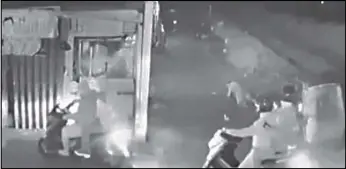  ??  ?? A screenshot of surveillan­ce footage from Barangay 484 in Manila shows four of six men on motorcycle­s attacking Leo Pilapil as the victim lay on the ground Saturday night.