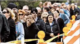  ??  ?? Mourners stand in line to attend the visitation for AJ at the Davenport Family Funeral Homes and Crematory in Crystal Lake on May 3.