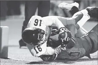  ?? DOUG DURAN — STAFF PHOTOGRAPH­ER ?? Pittsburg’s Donovan Crosse (16) gets past Freedom’s Diego Fratus to score a touchdown in the second quarter of Friday’s BVAL opener. Pittsburg won, 47-33, and handed Freedom its first loss of the season.