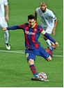  ??  ?? SPOT ON: Barcelona’s Messi scores from a penalty against Ferencvaro­s. — AP