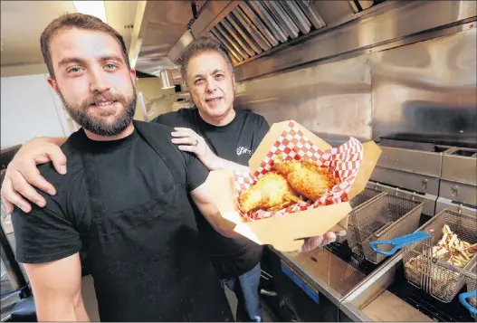  ?? CP PHOTO ?? Anthony Faraci and his father Phil are photograph­ed in their food truck as they relaunch his late uncle Paul Faraci’s original Pizza Pop - Paul’s Original Pizza Snack (POPS) in Winnipeg,