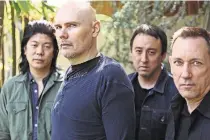  ?? ELIZABETH WEINBERG FOR THE NEW YORK TIMES ?? The Smashing Pumpkins are celebratin­g their 30th anniversar­y: from far left, James Iha, Billy Corgan, Jeff Schroeder (who joined later) and Jimmy Chamberlin.