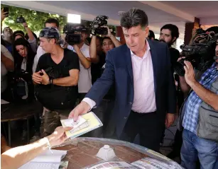  ?? (Jorge Adorno/Reuters) ?? PARAGUAYAN PRESIDENTI­AL candidate Efrain Alegre waits to cast his ballot in a polling station in Asuncion yesterday.