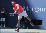  ?? JULIE JACOBSON — THE ASSOCIATED PRESS ?? Rafael Nadal, of Spain, serves to Alexandr Dolgopolov, of Ukraine, during the fourth round of the U.S. Open tennis tournament, Monday in New York.