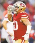  ?? Ezra Shaw / Getty Images ?? Niners linebacker Brock Coyle salutes after a play.