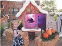 ??  ?? Samantha Brown, 5, plays with a display at her home in Tempe.