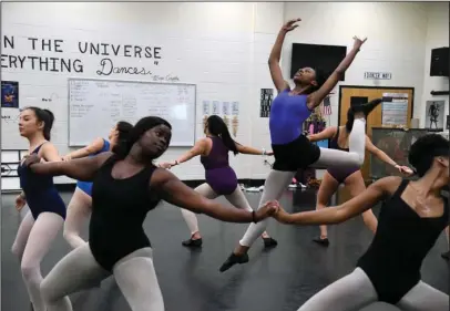  ?? The Sentinel-Record/Grace Brown ?? GREAT HEIGHTS: The dance troupe at Hot Springs World Class High School rehearses one last time Thursday before leaving for Austria today as part of a 13-day tour with Young! Tanzsommer.