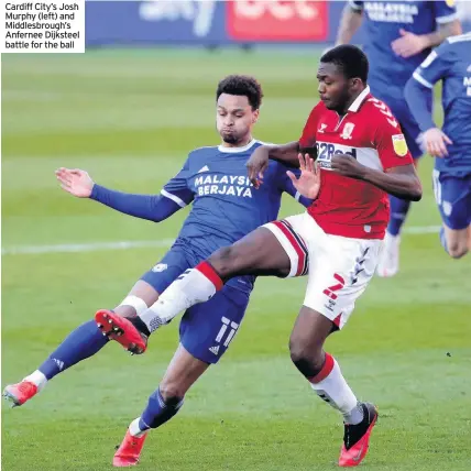  ??  ?? Cardiff City’s Josh Murphy (left) and Middlesbro­ugh’s Anfernee Dijksteel battle for the ball