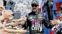  ?? STEVE HELBER / AP 2019 ?? As a 20-year NASCAR veteran, Jimmie Johnson has honed an effective leadership style, serving as a mentor to younger drivers including Bubba Wallace.