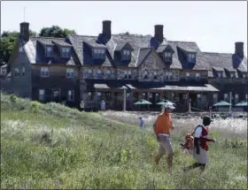  ?? MORRY GASH — THE ASSOCIATED PRESS FILE ?? In this Aug. 25, 2011, file photo, Peter Uihlein of Orlando, Fla., makes his way up the first fairway during the second round of match play at the U.S. Amateur golf tournament at Erin Hills Golf Course in Erin, Wisc. Erin Hills, in the middle of...